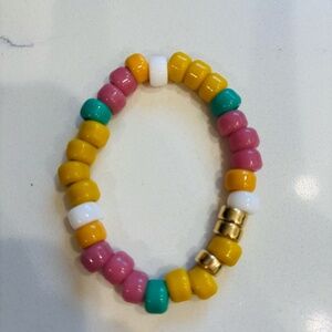 Plated 18 kt barrel and glass rainbow beads Elastic Bracelet